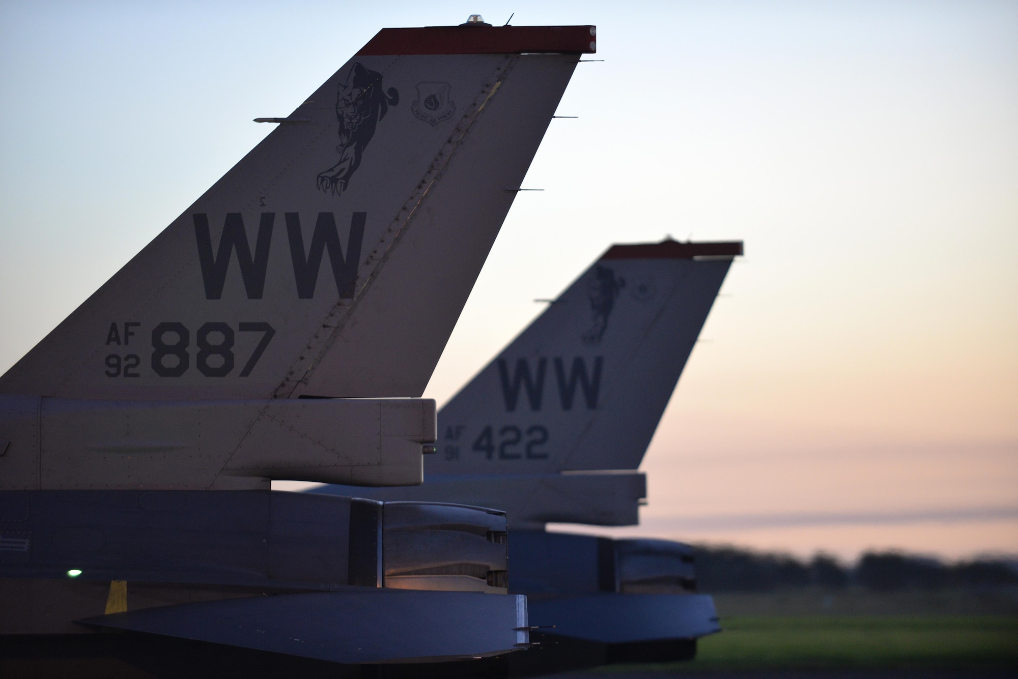 Wild Weasel F-16 Fighting Falcons sit side-by-side at Royal New Zealand Air Force Base Ohakea, New Zealand, Feb. 24, 2017. Maj. Richard Smeeding, F-16 demo pilot with the Pacific Air Forces demonstration team, and Capt. Mike Dreher, F-16 demo safety observer with the Pacific Air Forces' demonstration team, were the first to arrive, ahead of more than 20 more crew members traveling with them. (U.S. Air Force photo by Senior Airman Jarrod Vickers)