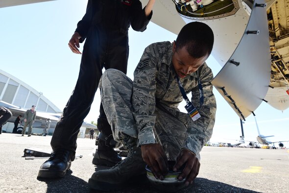 U.S. Air Force Staff Sgt. Ty Watkins, an electrical and environmental craftsman with the 35th Maintenance Squadron, changes a water coalescer at Royal New Zealand Air Force Base Ohakea, New Zealand, Feb. 25, 2017. Water coalescers prevent water and oil from going through the environmental system so they don’t reach the turbine. This stops smoke and fumes from entering the cockpit. Watkins is one of 11 maintainers traveling with Pacific Air Forces' Demonstration Team throughout the Indo-Asia-Pacific region. (U.S. Air Force photo by Senior Airman Jarrod Vickers)