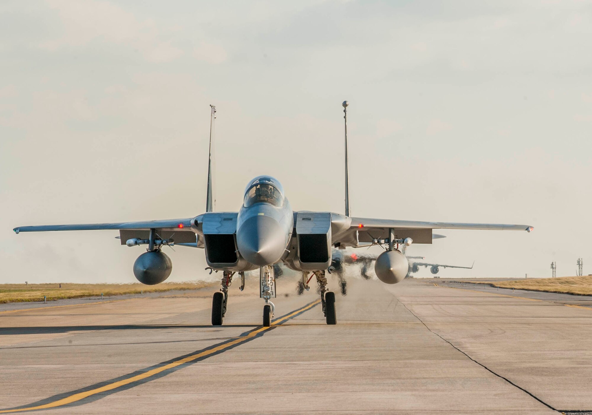 A group of F-15 Eagles taxi down the flightline on Kadena Air Base, Japan, as they prepare for takeoff during a multi-service exercise Feb. 16, 2017. Joint opportunities such as these are important so both Navy and Air Force pilots can understand the capabilities and limitations of their counterparts to effectively provide for the common defense of Japan. (U.S. Air Force photo by Senior Airman Nick Emerick/Released) 