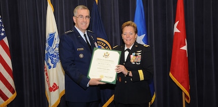 U.S. Air Force Gen. John E. Hyten, commander of U.S. Strategic Command (USSTRATCOM), presents the Certificate of Retirement to U.S. Army Maj. Gen. Heidi V. Brown, USSTRATCOM director of global operations, during a ceremony in the 557th Weather Wing auditorium, Offutt Air Force Base, Neb., Feb. 24, 2017. Brown served more than 35 years in the U.S. Army and will effectively retire Apr. 1, 2017. Brown holds many distinctions, including the first woman to command and lead a U.S. Army brigade into combat, the first female general in the U.S. Army Air Defense Artillery Branch, the senior female combat arms officer in the Army, the first female combatant command operations director and the first soldier to serve as USSTRATCOM director of global operations. Brown arrived at USSTRATCOM in February 2015, after serving as Missile Defense Agency’s test director at Fort Belvoir, Md.