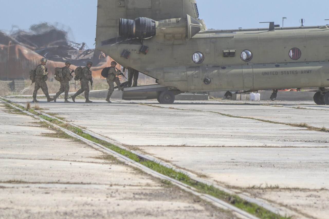 U.S. Army Soldiers deployed in support of Combined Joint Task Force-Operation Inherent Resolve board a U.S. Army CH-47 Chinook helicopter at tactical assembly area Hamam al-Alil, Iraq, Feb. 22, 2017. CJTF-OIR is the global Coalition to defeat ISIS in Iraq and Syria. (U.S. Army photo by Staff Sgt. Jason Hull)