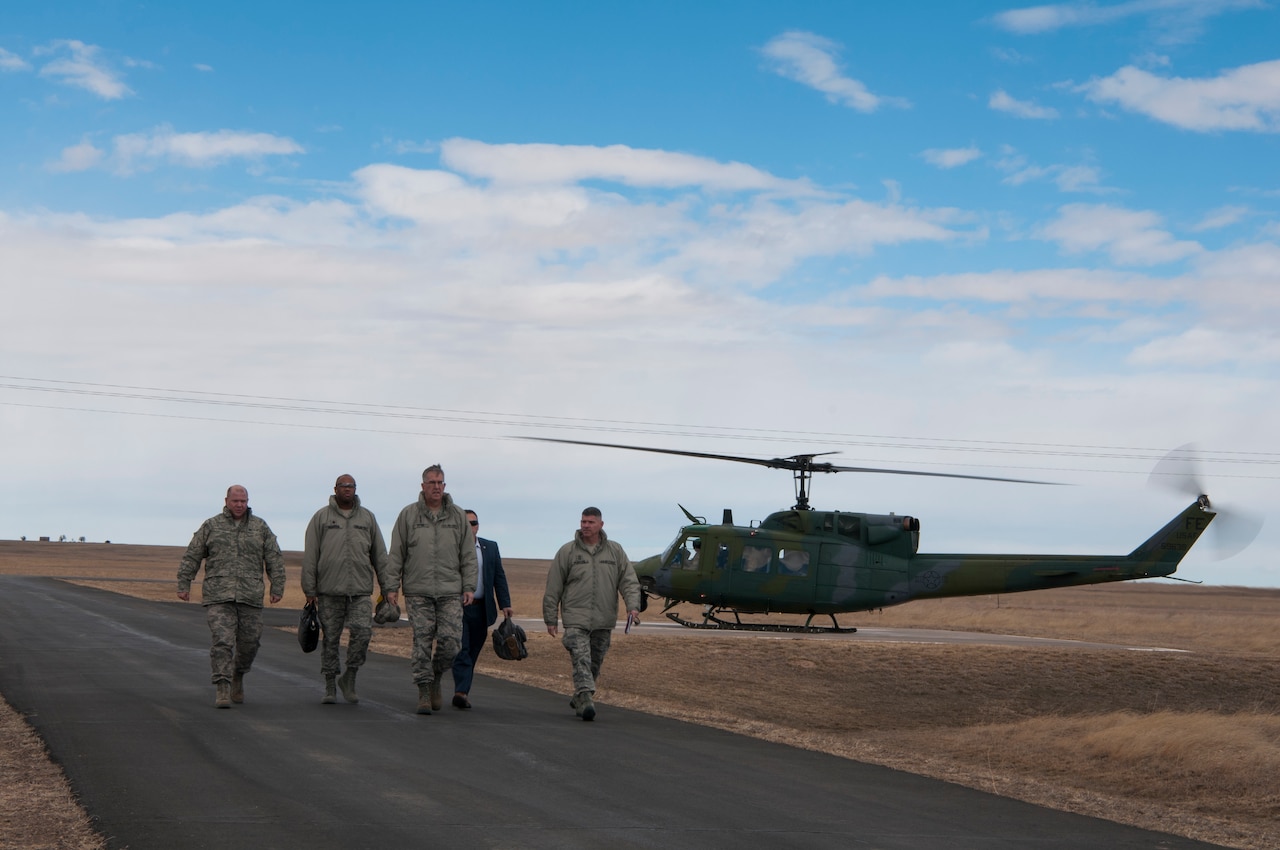 U.S. Air Force Gen. John E. Hyten, U.S. Strategic Command commander, and members of his staff depart a 37th Helicopter Squadron UH-1N Huey near a missile alert facility on the F.E. Warren Air Force Base missile complex, Feb. 22, 2017. Hyten toured the MAF, giving him insight into the responsibilities of the Airmen executing the nation’s nuclear deterrence mission. This was Hyten’s first visit to the 90th Missile Wing as USSTRATCOM commander. (U.S. Air Force photo by Staff Sgt. Christopher Ruano)