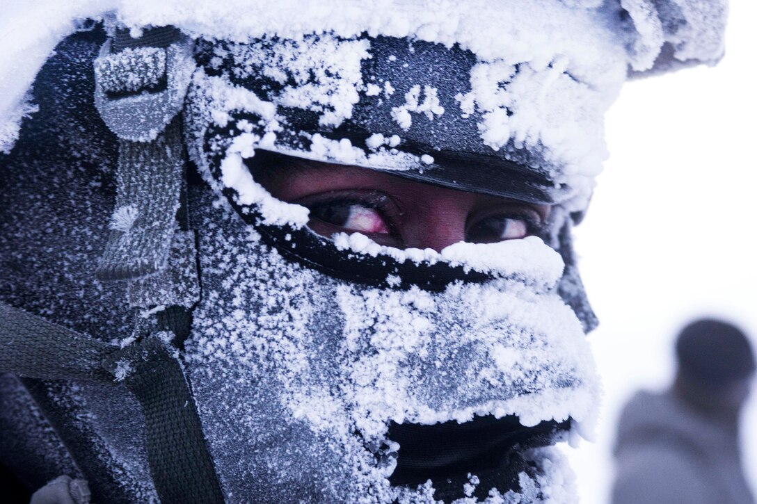 A soldier waits for transportation after a successful airborne operation during Spartan Pegasus in Deadhorse, Alaska, Feb. 22, 2017. The exercise simulated the recovery of a downed satellite and tested the soldiers' operational abilities in temperatures 30 degrees below zero. Army photo by Staff Sgt. Daniel Love