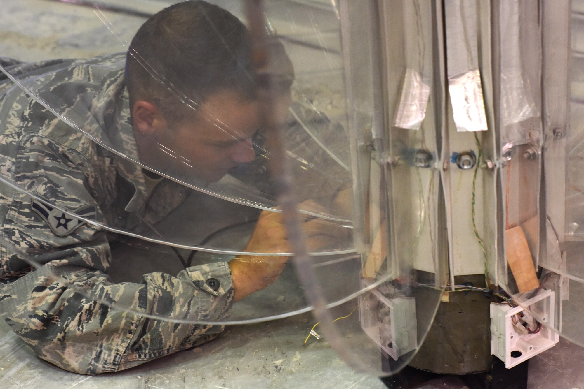 U.S. Air Force Airman 1st Class Bryce Armstrong, an electrical systems journeyman with the 379th Expeditionary Civil Engineer Squadron, works on a New Year’s Eve light up ball that he and Airmen from his unit repaired at Al Udeid Air Base, Qatar, Dec. 21, 2016. This ball will be lowered on New Year’s Eve in celebration of the new year. (U.S. Air Force photo by Senior Airman Cynthia A. Innocenti)