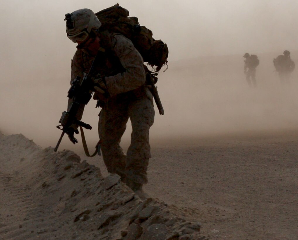 U.S. Marine Lance Cpl. Nathan P. Olson with 3rd Battalion, 7th Marine Regiment, Special Purpose Marine Air-Ground Task Force-Crisis Response-Central Command, prepares to set up a security perimeter after exiting an MV-22 Osprey from Medium Tilt Rotor Squadron-165, while forward deployed to the Middle East, Dec. 26, 2016. Marines with 3/7 compose the ground combat element, to include the dedicated TRAP force, for SPMAGTF-CR-CC within the Central Command area of operations, spanning 20 countries. SPMAGTF-CR-CC is currently forward deployed to several host nations, with the ability to respond to a variety of contingencies rapidly and effectively.  (U.S. Marine Corps photo by Lance Cpl. Christopher D. Thompson)