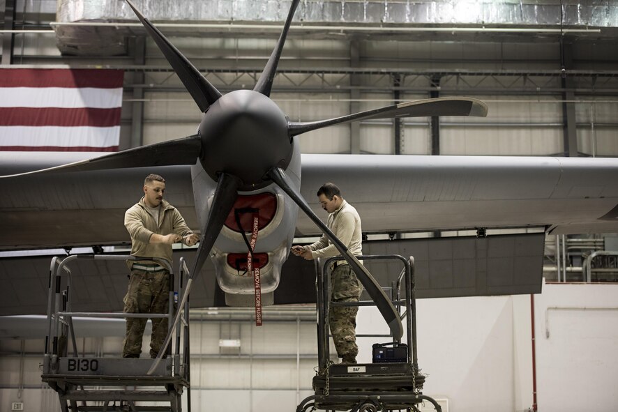 Staff Sgt. Kyle Pringle and Senior Airman Jacob Porter, 455th Expeditionary Aircraft Maintenance Squadron aerospace propulsion technicians, remove panels from an engine on a C-130J Hercules Dec. 5, 2016 at Bagram Airfield, Afghanistan. The C-130J incorporates state-of-the-art technology, which reduces manpower requirements, lowers operating and support costs, and provides life-cycle cost savings over earlier C-130 models. (U.S. Air Force photo by Staff Sgt. Katherine Spessa)