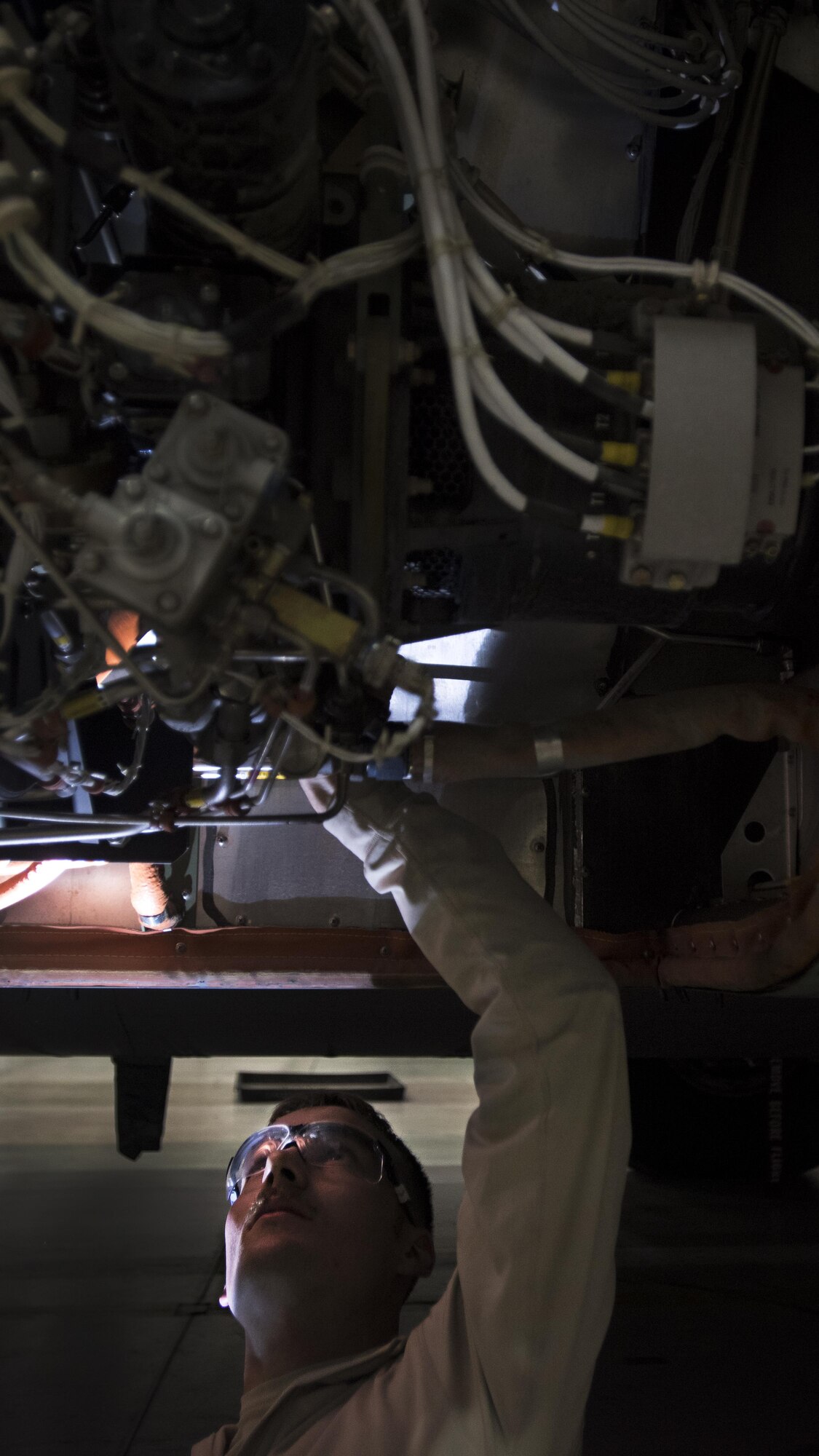 Senior Airman Zackery Schaadt, 455th Expeditionary Aircraft Maintenance Squadron crew chief, performs an inspection on a C-130J Hercules Dec. 5, 2016 at Bagram Airfield, Afghanistan. The 455th EAMXS’ C-130 aircraft maintenance unit is based out of Little Rock, Arkansas, along with the 774th Expeditionary Airlift Squadron and their contingent of C-130 aircraft. (U.S. Air Force photo by Staff Sgt. Katherine Spessa)