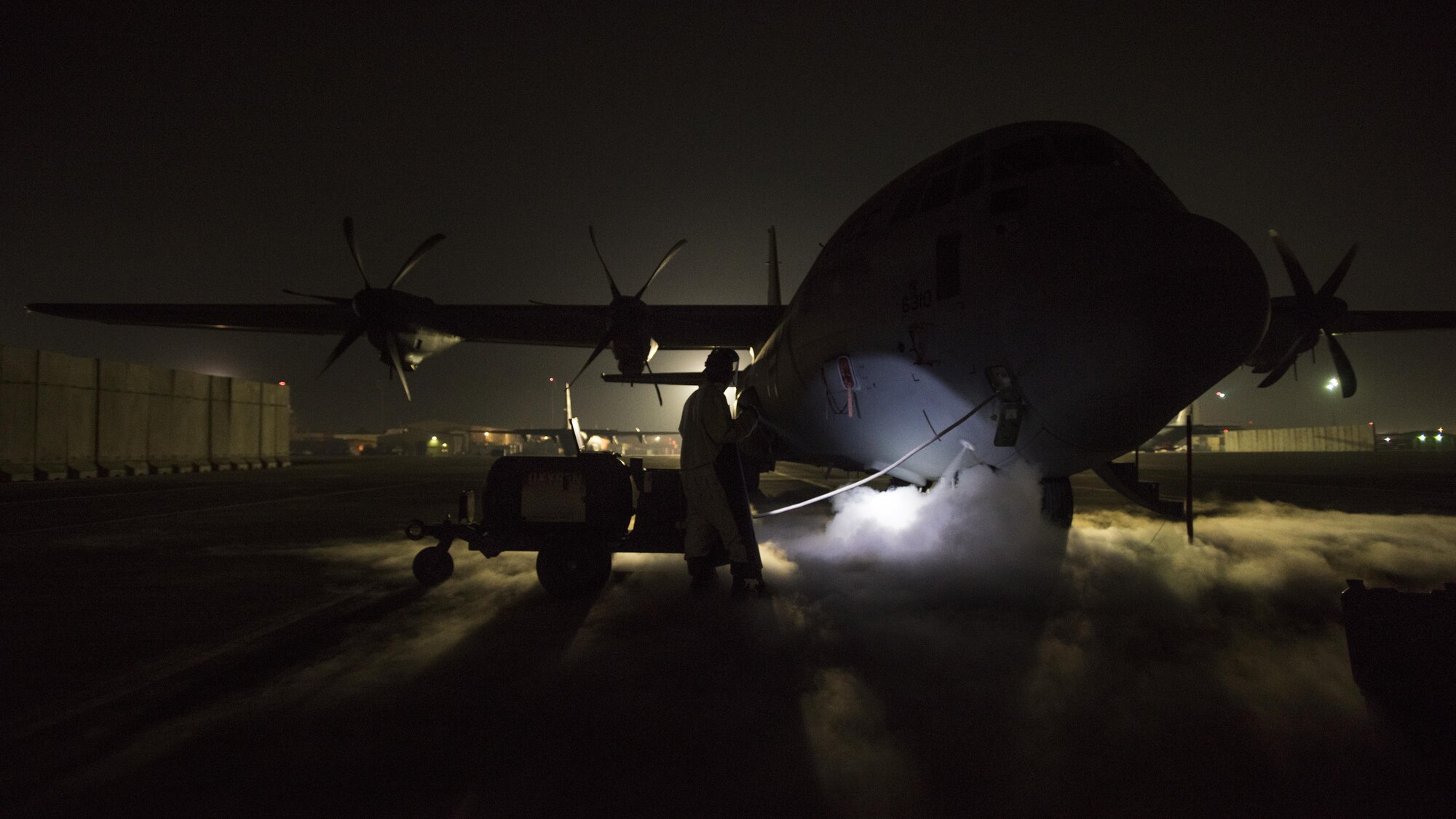 Airman 1st Class Bryant Parks, 455th Expeditionary Aircraft Maintenance Squadron crew chief, services liquid oxygen on a C-130J Hercules Dec. 9, 2016 at Bagram Airfield, Afghanistan. The C-130J/J-30 also includes improved fuel, environmental and ice-protection and an enhanced cargo-handling system over older models. (U.S. Air Force photo by Staff Sgt. Katherine Spessa)