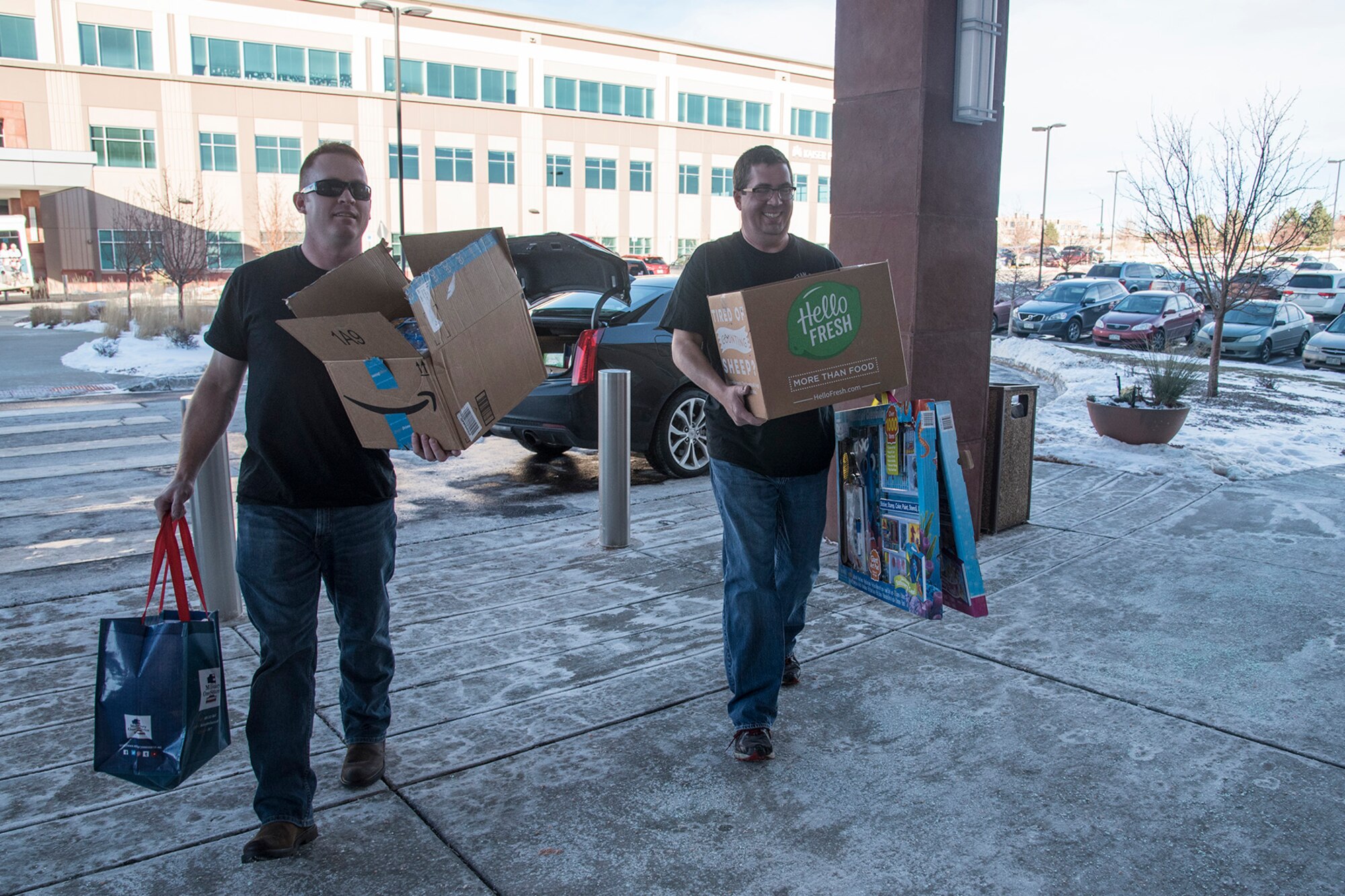 COLORADO SPRINGS, Colo. - Tech. Sgts. Thomas Echelmeyer and Aaron Farris, 5/6 Club members from Peterson Air Force Base, Colo., drop off toys at the Pediatric Center for Cancer and Blood Disorders at Children's Hospital Colorado, Dec. 19, 2016, in Colorado Springs, Colo. This year the 5/6 Club was able to collect approximately $3000 worth of toys from members of Team Pete and the U.S. Air Force Academy. The toys are used for holiday gifts and for use throughout the year while patients receive treatment. (U.S. Air Force photo by Staff Sgt. Tiffany DeNault)