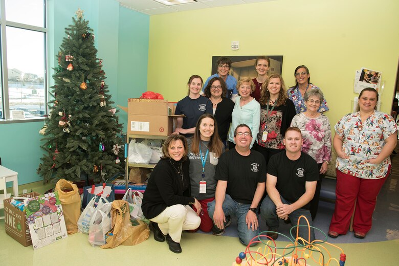 COLORADO SPRINGS, Colo. - Airmen from the 5/6 Club, Peterson Air Force Base, Colo., drop off toys at the Pediatric Center for Cancer and Blood Disorders at Children's Hospital Colorado, Dec. 19, 2016, in Colorado Springs, Colo. This year the 5/6 Club was able to collect approximately $3000 worth of toys from members of Team Pete and the U.S. Air Force Academy. The toys are used for holiday gifts and for use throughout the year while patients receive treatment. (U.S. Air Force photo by Staff Sgt. Tiffany DeNault)
