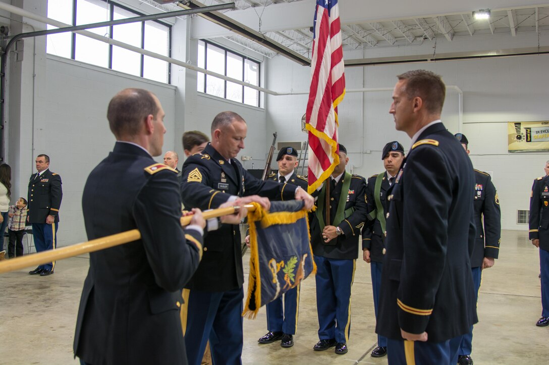 LANCASTER, Pa. - The 3rd Battalion 319th Regiment Command Sgt. Maj. David W. Hausler (left) furls the flag as the Commander of the 800th Logistics Support Brigade, Col. Bradly Boganowski, (right) awaits to receive the encased flag during the unit’s deactivation ceremony held here on Dec. 17, 2016. The ceremony marks the closing of the unit as part of a larger restructuring of the 800th Logistics Support Brigade, headquartered in Mustang, Oklahoma.