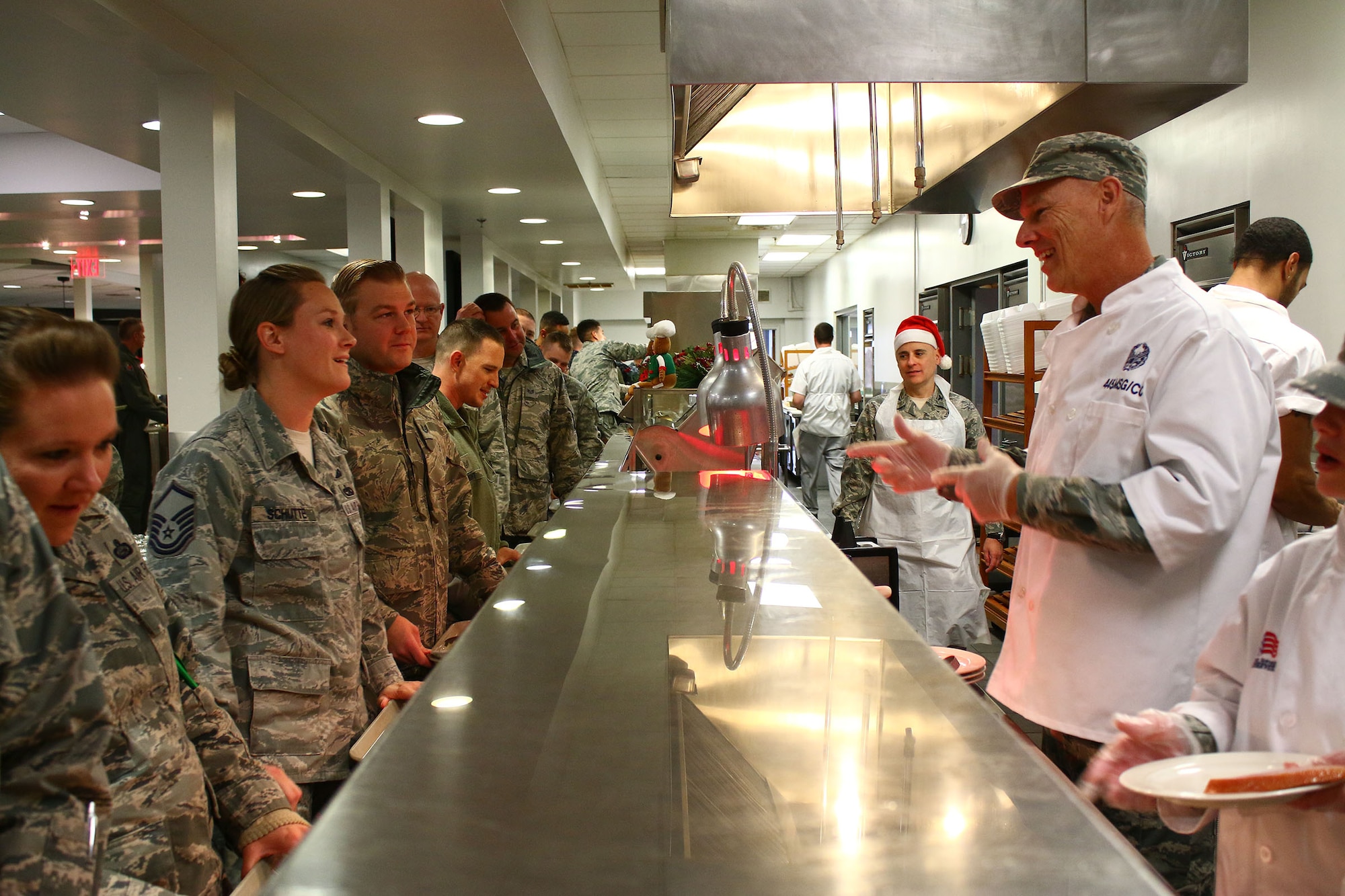 Lt. Col. Dale Bateman, 445th Mission Support Group commander, serves holiday meals to 445th Airlift Wing Airmen at the Pitsenbarger Dining Facility during the December 4, 2016 unit training assembly. (U.S. Air Force photo/Tech. Sgt. Patrick O'Reilly)