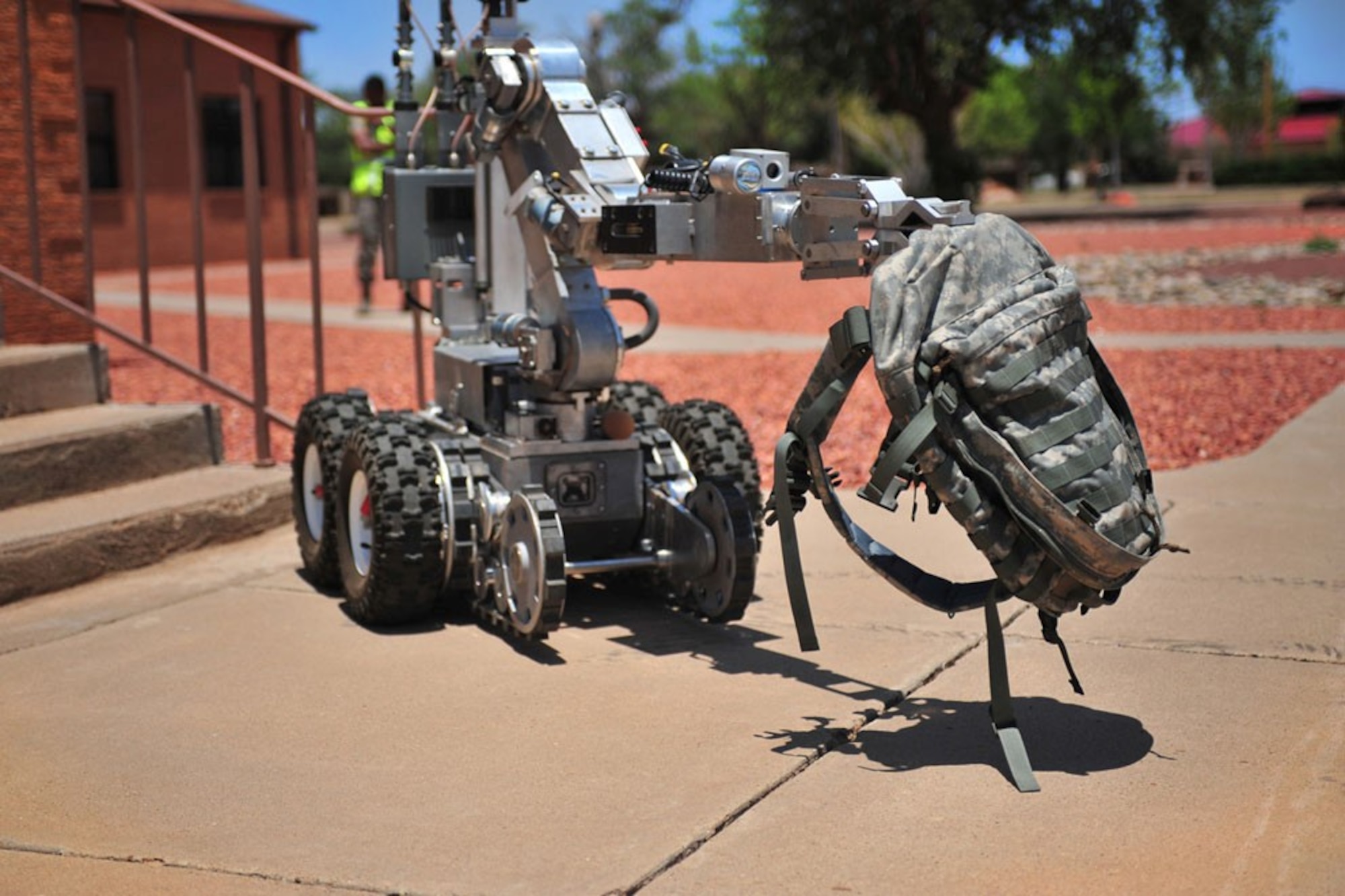 An explosive ordnance disposal technician mobilizes a robot to remotely identify a suspicious device as part of a training exercise. EOD technicians commonly use robots as a method of first entry to keep themselves safe during crisis response situations. (U.S. Air Force photo)