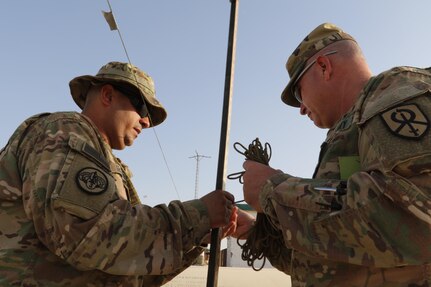 Sgt. Jose Irizarry, left, and Maj. William Rozar, both working as inspector generals for the 1st Theater Sustainment Command-Operational Command Post, test the measuring methods being used by Department of Defense contractors at a fuel farm in central Iraq. The 1st TSC OCP is responsible for overseeing fuel logistics in multiple countries throughout Southwest Asia.(U.S. Army photo by Sgt. Brandon Hubbard, USARCENT Public Affairs/RELEASED)