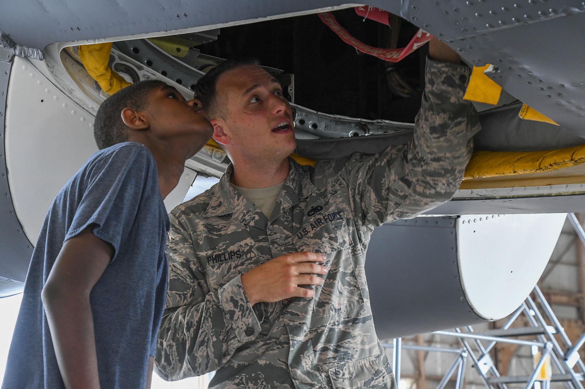 U.S. Air Force Master Sgt. William George, assigned to the 442nd Maintenance Squadron, shows high school students a rebuilt jet engine from an A-10 Thunderbolt on July 13, 2016. The students are receiving a tour of the maintenance sections on Barksdale Air Force Base, La. while attending the Aviation Maintenance Summer Camp offered by Southern University at Shreveport.  (U.S. Air Force photo by Master Sgt. Dachelle Melville/Released)