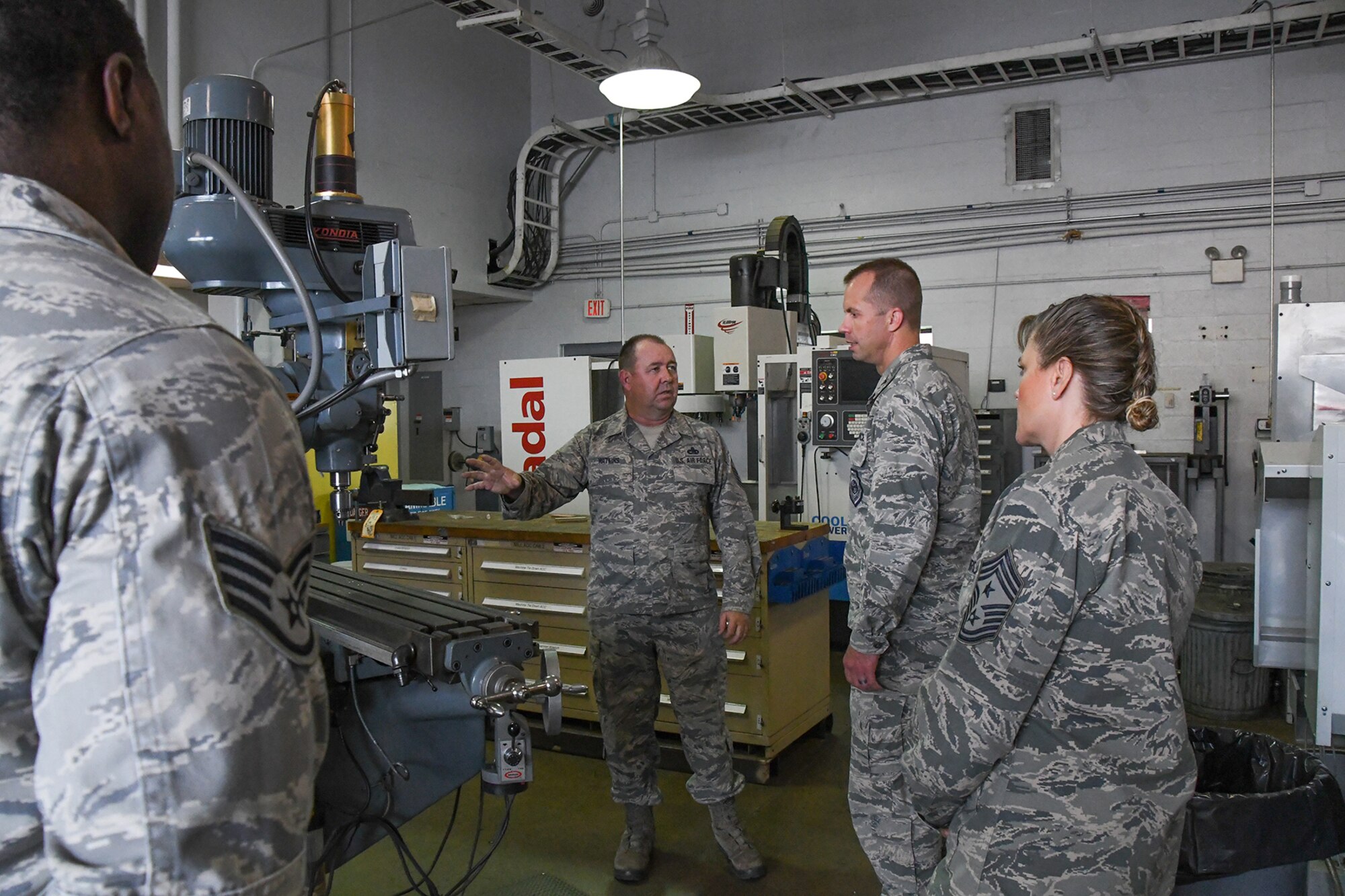 U.S. Air Force Master Sgt. Gene Watkins, a Metals Technology supervisor assigned to the 307th Maintenance Squadron, shows the different equipment available to the Reservists and integrated Active Duty Airmen in the Metals Technology Flight to Col. Ty Neuman, the 2nd Bomb Wing commander, and Chief Master Sgt. Teresa Clapper, the Command Chief for the 2 BW, on August 15, 2016. Neuman is the new base commander for Barksdale Air Force Base in Louisiana and is receiving a tour of the 307th Bomb Wing which is a tenant unit on the base. (U.S. Air Force photo by Master Sgt. Dachelle Melville/Released)