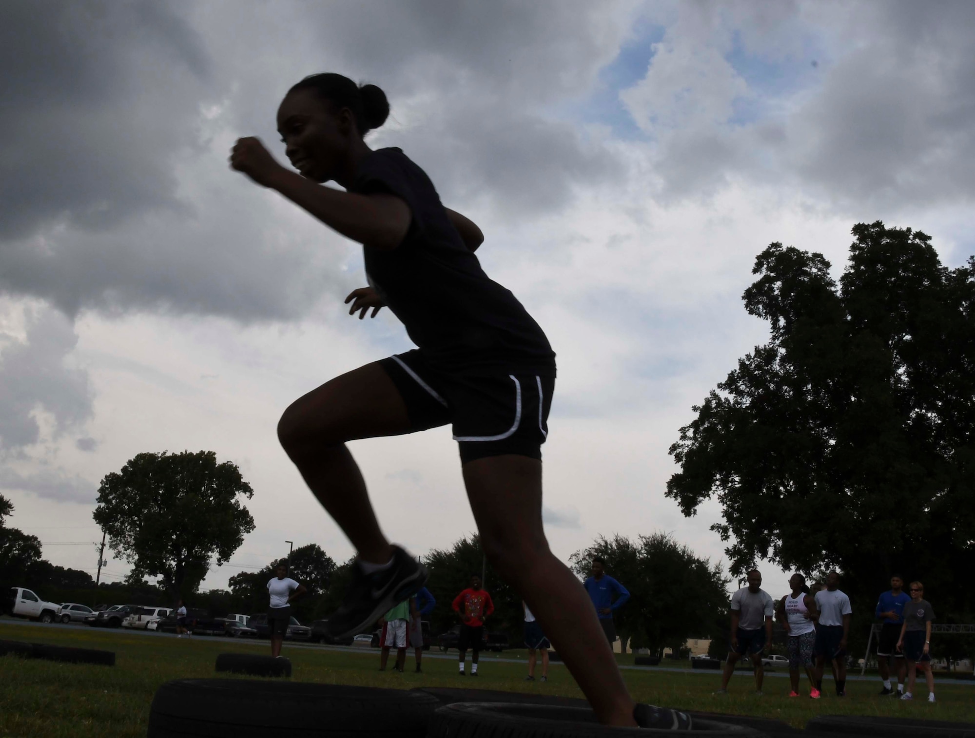 A trainee assigned to the 307th Developmental Training Flight, races through the tire obstacle challenge September 11, 2016 at Barksdale Air Force Base, La.  Both trainees from the 307th DTF and airmen from the 307th Bomb Wing came together to form three teams to compete in the first Fit to Fight Challenge.  The 307th Force Support Squadron designed the challenge to encourage competition and boost morale within the 307th Bomb Wing.  (U.S. Air Force photo by Senior Airman Callie Ware/ Released)