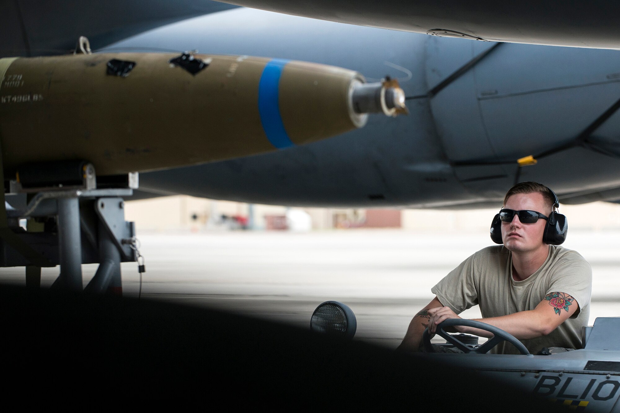 A member of a Weapons Load Crew operates an MJ-1 bomb lift truck to line up an inert 500 pounds general purpose bomb prior to it being loaded on a B-52H Stratofortress, Sept. 27, 2016, Barksdale Air Force Base, La. Weapons personnel are required to keep current their loading certification through quarterly evaluations in order to perform live weapons loads on the aircraft. (U.S. Air Force photo by Master Sgt. Greg Steele/Released)