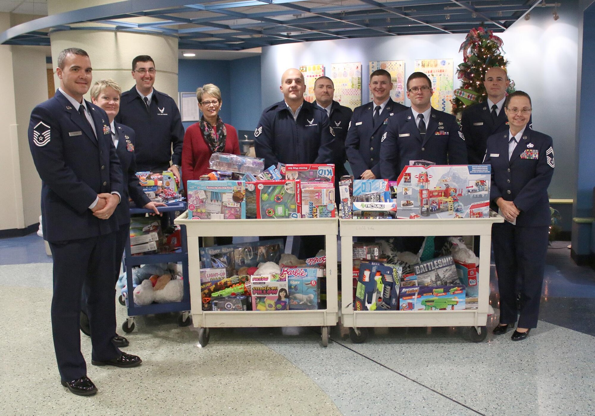 Airmen from the 87th Aerial Port Squadron visit children at the Dayton Children’s Hospital giving out toys and holiday cheer December 16, 2016. More than 15 members participated in the unit’s 26th annual event. (U.S. Air Force photo/Tech. Sgt. Patrick O'Reilly)