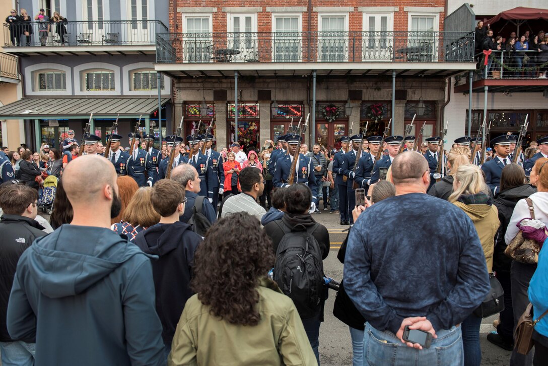Members of the U.S. Air Force Honor Guard perform a rifle maneuver for the crowd during the Allstate Sugar Bowl New Years Eve Parade in New Orleans, LA, Dec. 31, 2016.  The parade consisted of floats, bands, marching units and other performers to entertain fans prior to the Allstate Sugar Bowl between the Auburn Tigers and Oklahoma Sooners on Jan. 2, 2017. 