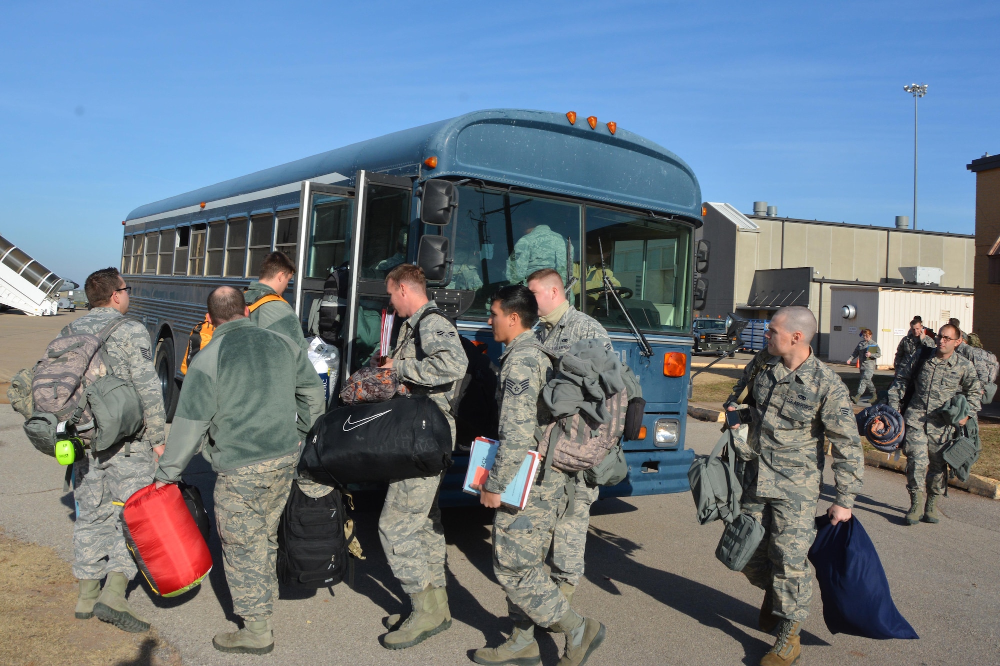 Deploying Citizen Airmen file into the bus to process for a deployment to Incirlik Air Base, Turkey.  Ninety-four 507th Air Refueling Wing Airmen departed to Southwest Asia Dec 12-13, 2016 to support deployed air refueling operations. (U.S. Air Force Photo/Maj. Jon Quinlan)