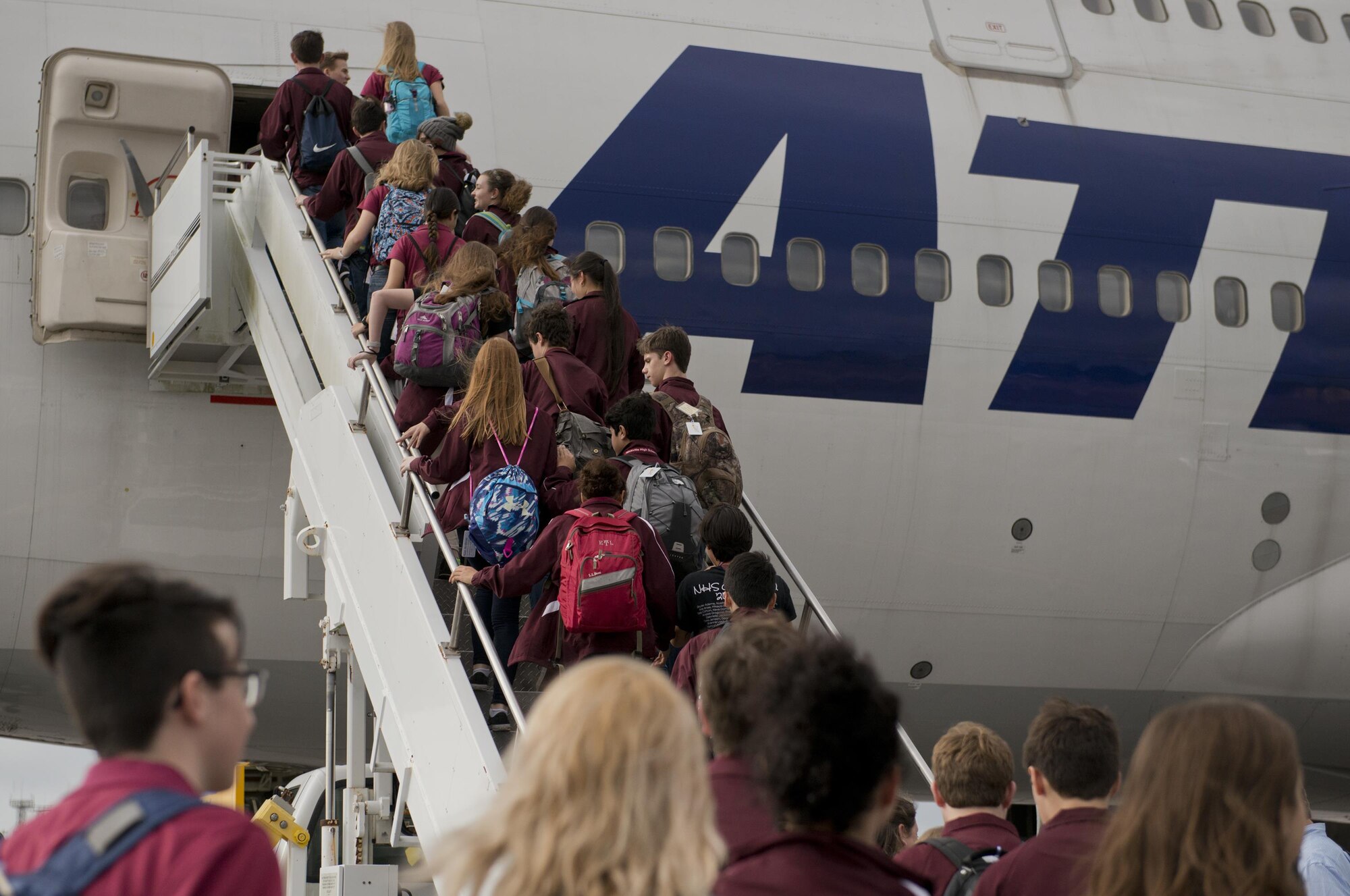Over 300 Niceville High School band students and staff members board on Eglin’s flight line Dec. 29 traveling for their performance in the 2017 Tournament of Roses Parade in California. The crew of five loadmasters, also known as the ‘port dogs’ loaded nearly 82,000 pounds of equipment in less than two hours. (U.S. Air Force photo/Kristin Stewart)