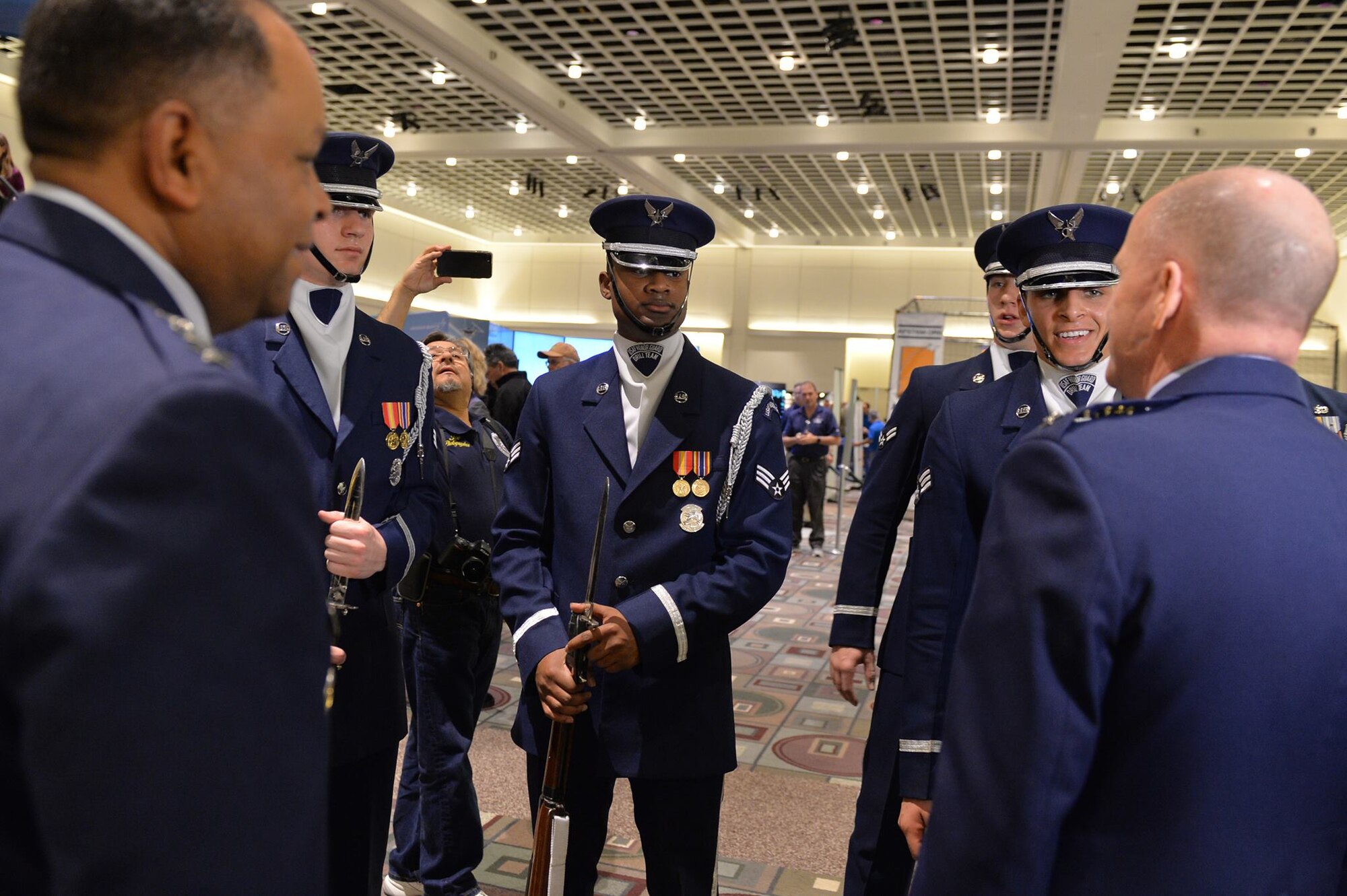U.S. Air Force Honor Guard Drill Team members speak to Gen. Stephen Wilson, Vice Chief of Staff of the U.S. Air Force, after performing at the opening ceremony of the Live On Green event in Pasadena, Cali., Dec. 30, 2016. The festivities included a cake cutting ceremony to commemorate the Air Force's 70-year anniversary of providing America with unmatched airpower and rapid global response. (U.S. Air Force photo by Airman 1st Class Kristan Campbell)