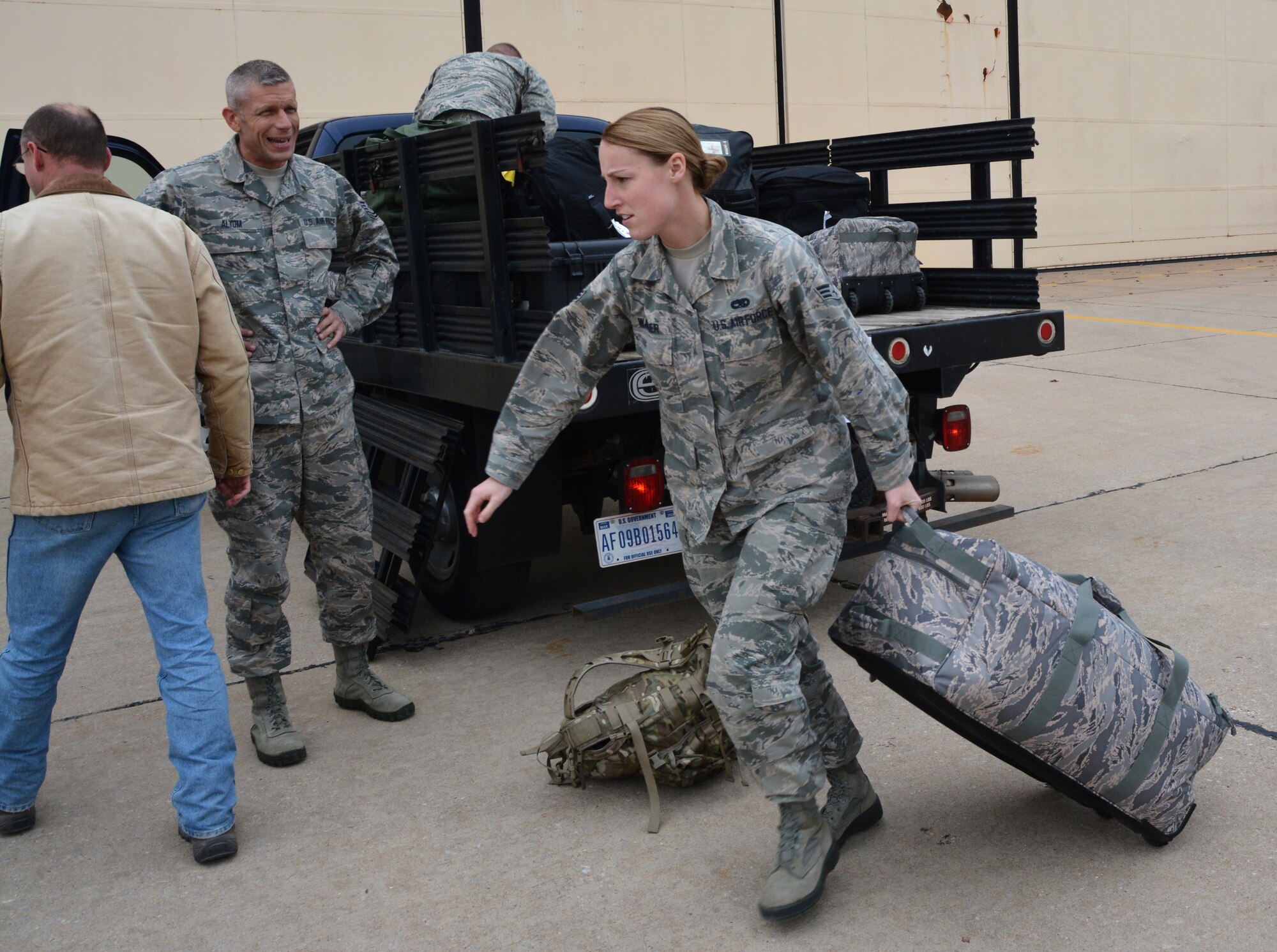 Senior Airman Jenifer Wagoner, 507th Maintenance Group loads her bag into a truck Dec 12, 2016 at Tinker Air Force Base, Oklahoma prior to deploying to Incirlik Air Base, Turkey.  Wagoner is deployed to support maintenance operations as an analyst. (U.S. Air Force Photo/Tech. Sgt. Lauren Gleason)