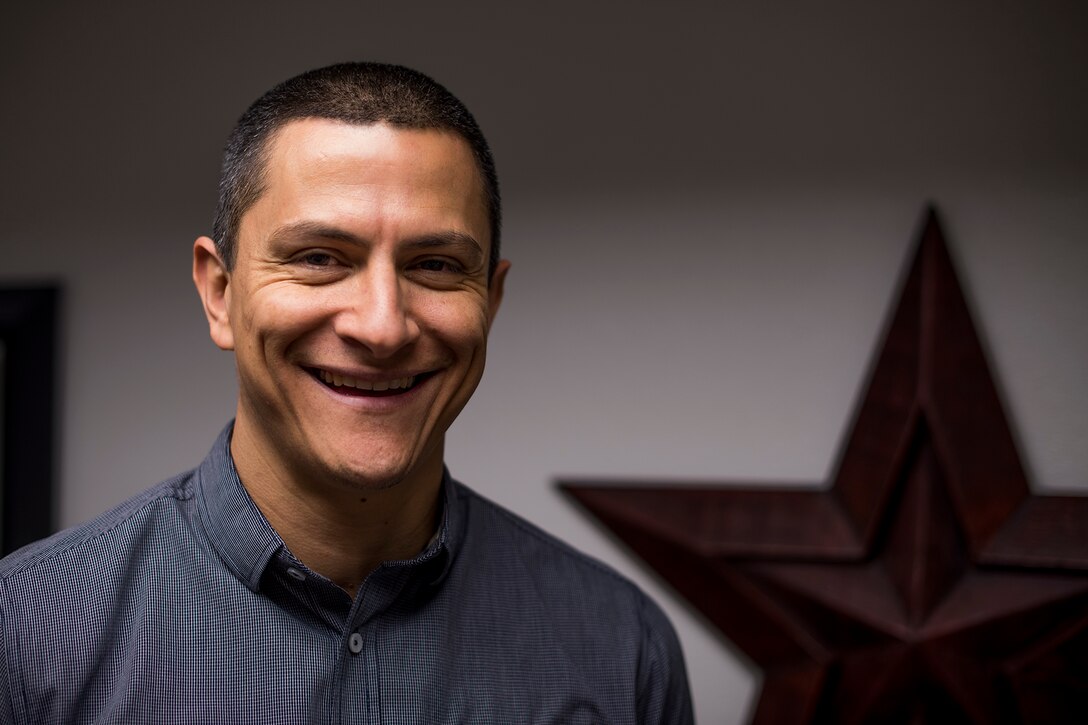 Andy Pecina, Airman and Family Readiness Center work-life specialist, says his New Year’s resolution is to write a service oriented book to help others have a better life by inspiring thought, provoking action and ensuring others that they know they aren’t alone. (U.S. Air Force photo by Senior Airman Devin Boyer/Released)