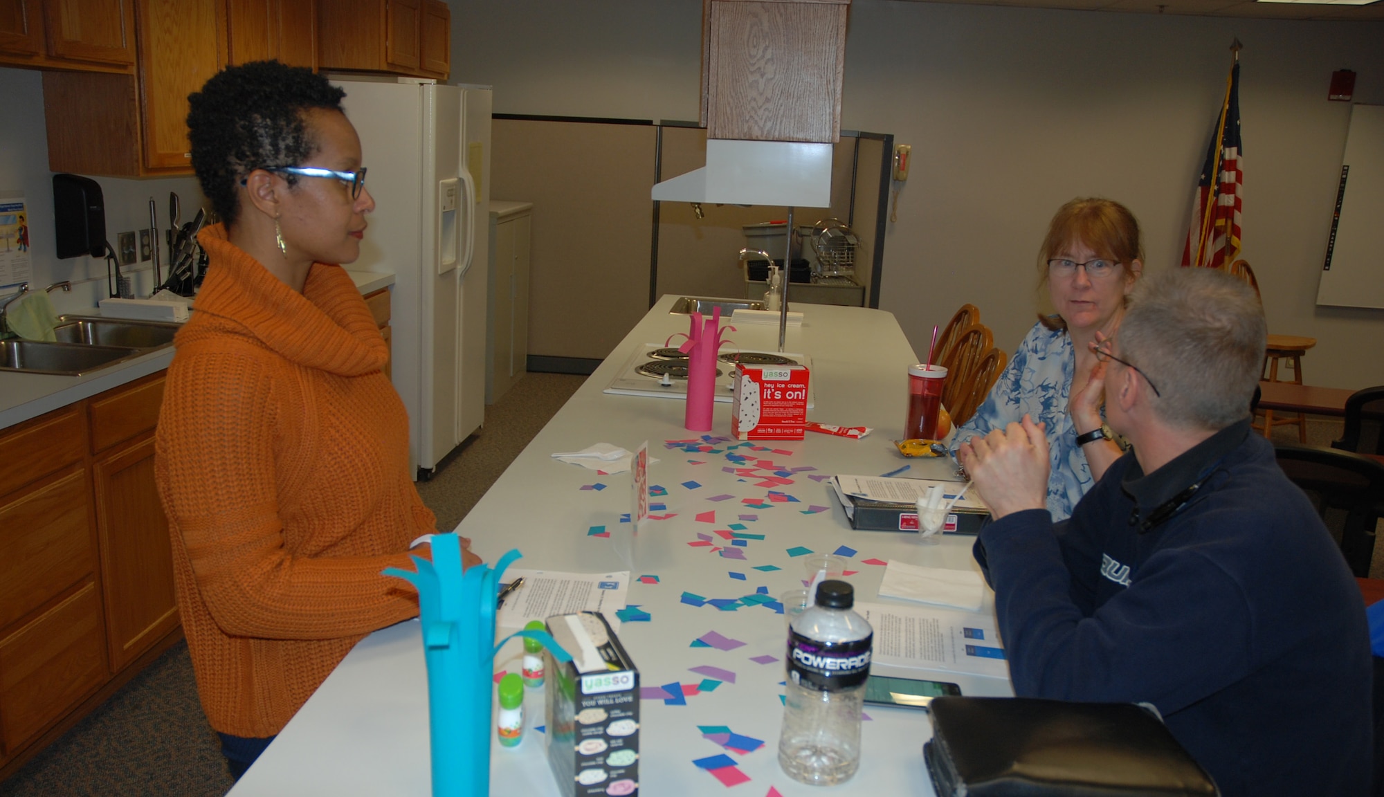 PETERSON AIR FORCE BASE, Colo. -- Dana Johnson, health promotion educator at the Health and Wellness Center, discusses healthy snack alternatives as part of the Group Lifestyle Balance class with Margaret Haché, military spouse, and Alan Kokes, 302nd Communications Squadron, at the HAWC on Peterson Air Force Base, Colo., Jan. 3, 2016. The class aims to develop healthy habits to begin the new year. (U.S. Air Force photo by Dave Smith)