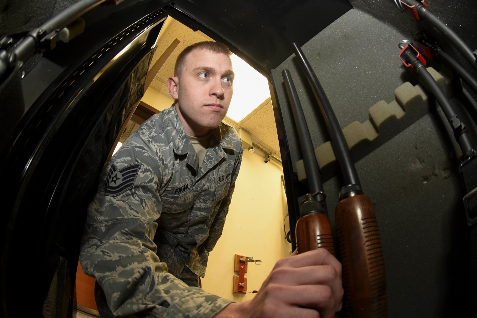 Tech. Sgt. Blake Fagan, 8th Operations Support Squadron aircraft management training noncommissioned officer in charge, grabs a shotgun from a weapons locker at Kunsan Air Base, Republic of Korea, Jan. 3, 2017. Fagan’s responsibilities include the Bird/wildlife Aircraft Striking Hazard program. Through the BASH program he uses multiple tools to deter wildlife that could cause significant damage to aircraft. (U.S. Air Force photo by Senior Airman Michael Hunsaker)