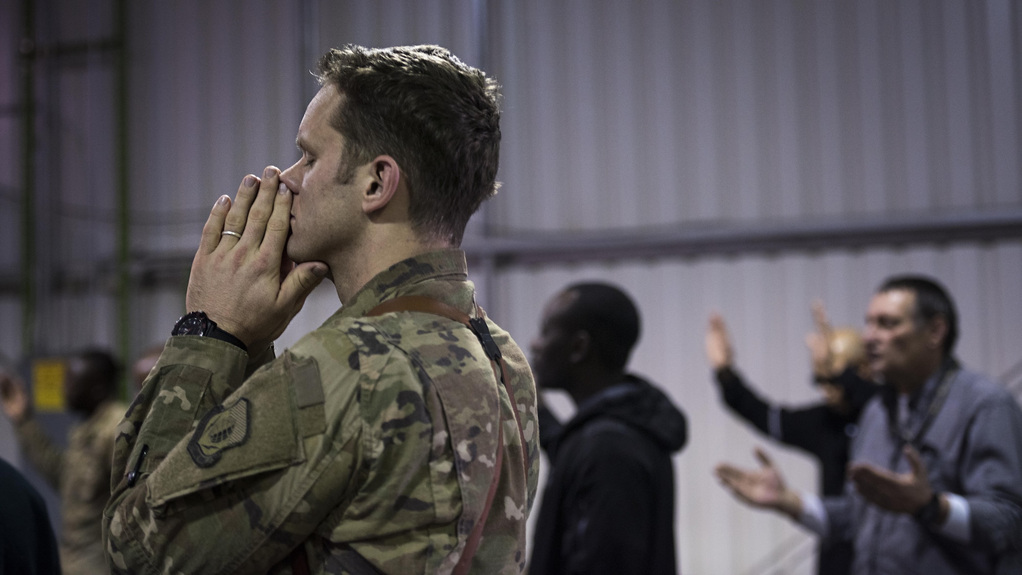 Capt. Stephen, 455th Expeditionary Operations Support Squadron, prays during a service held Jan. 1, 2016 at the Warrior Chapel, Bagram Airfield, Afghanistan. The 455th Air Expeditionary Wing chaplains and their sister service partners offer a variety of religious services for all faiths throughout the week at several chapels around Bagram. (U.S. Air Force photo by Staff Sgt. Katherine Spessa)