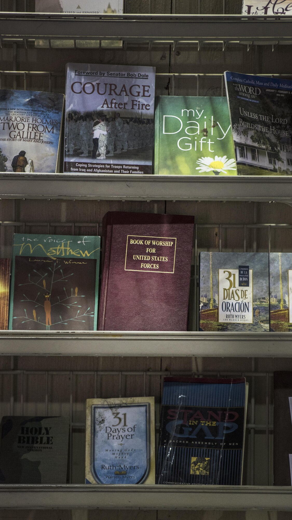 A “Book of Worship for United States Forces,” sits on a shelf along with other religious reading material at the Warrior Chapel Jan. 1, 2016 at Bagram Airfield, Afghanistan. Service members deployed to Bagram are welcome to attend chapel services, religious study groups and seek counseling from chaplains during their deployment here. (U.S. Air Force photo by Staff Sgt. Katherine Spessa)