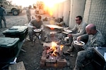 U.S. Army Soldiers eat their Thanksgiving meal on Combat Outpost Cherkatah, Khowst province, Afghanistan, Nov. 26, 2009. The Soldiers are deployed with Company D, 3rd Battalion, 509th Infantry Regiment.