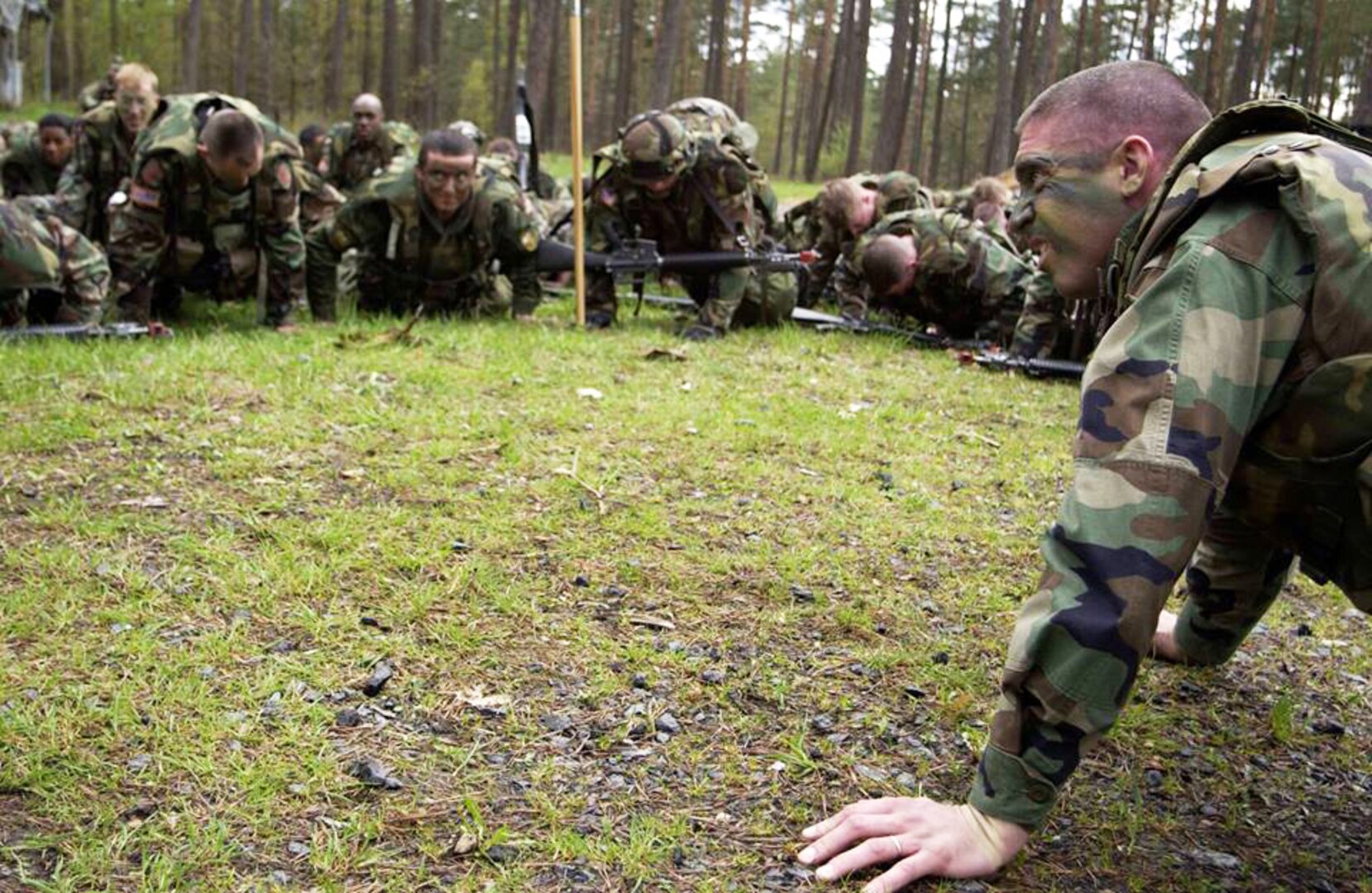Former Army 1st Sgt. Todd Lutz leads a group of students at the 7th Noncommissioned Officers Academy in Grafenwoehr, Germany, through in-cadence pushups in 2006. Lutz now uses his experience in the Army, including as a former Ranger Regiment cook, to help feed 290,000 troops throughout the Middle East, Africa and Europe.
