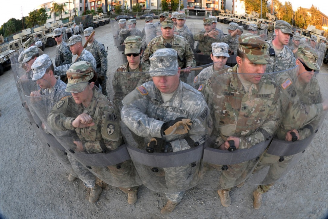 Members of the 270th and 649th Military Police Companies, 49th Military Police Brigade, California Army National Guard, move into formation to respond to a civil disturbance in Los Angeles, Nov. 17, 2016, during Exercise Vigilant Guard 17 at the Federal Emergency Management Agency Headquarters, California Task Force I, Los Angeles. Army National Guard photo by Staff Sgt. Eddie Siguenza