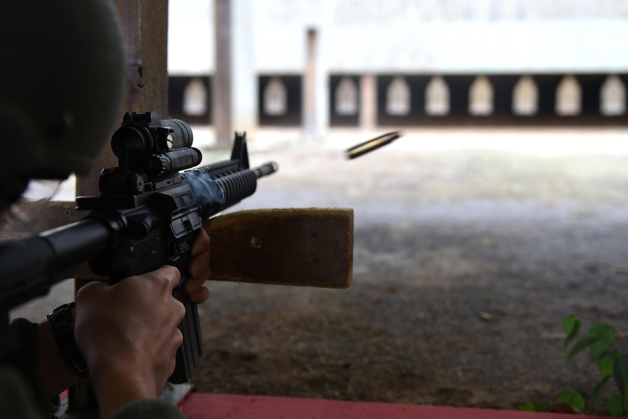 U.S. Air Force Senior Airman James Pritt, 19th Maintenance Squadron aircraft fuel systems journeyman, fires a M4 assault rifle during a Combat Arms Training and Maintenance session Dec. 14, 2016, at Little Rock Air Force Base, Ark. CATM ensures Air Force personnel are trained in the proper use of weapons and maintenance prior to deploying or changing duty stations. (U.S. Air Force photo by Airman 1st Class Kevin Sommer Giron)