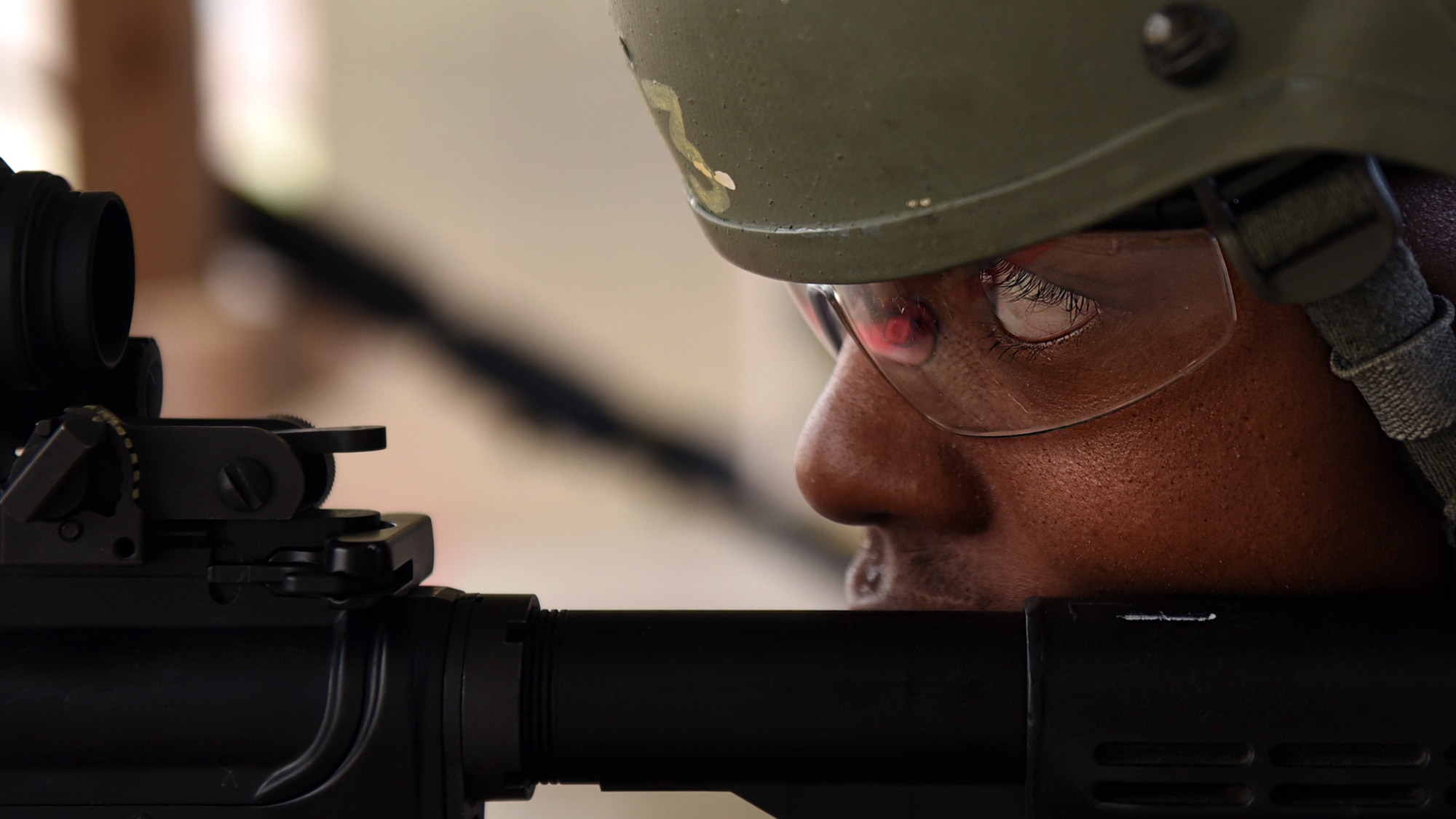 U.S. Air Force Senior Airman Jourdan Chaney, 19th Operations Support Squadron airfield management journeyman, aims an M4 assault rifle toward a target during a Combat Arms Training and Maintenance session Dec. 14, 2016, at Little Rock Air Force Base, Ark. CATM instructors teach the proper use of a variety of weapons, including the M4 assault rifle, M9 pistol and the M107 sniper rifle. (U.S. Air Force photo by Airman 1st Class Kevin Sommer Giron)