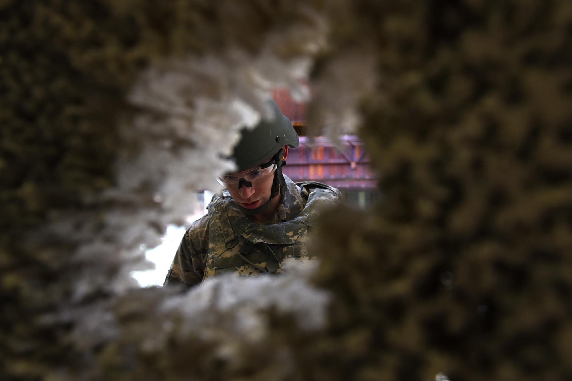 U.S. Air Force Airman 1st Class Nicholas Sands, 19th Civil Engineer Squadron firefighter, makes sight adjustments to his M4 assault rifle during a Combat Arms Training and Maintenance session Dec.14, 2016, at Little Rock Air Force Base, Ark. CATM instructors reviewed Sands’ target in order to assess that the M4 assault rifle qualifications were met. (U.S. Air Force photo by Airman 1st Class Kevin Sommer Giron)