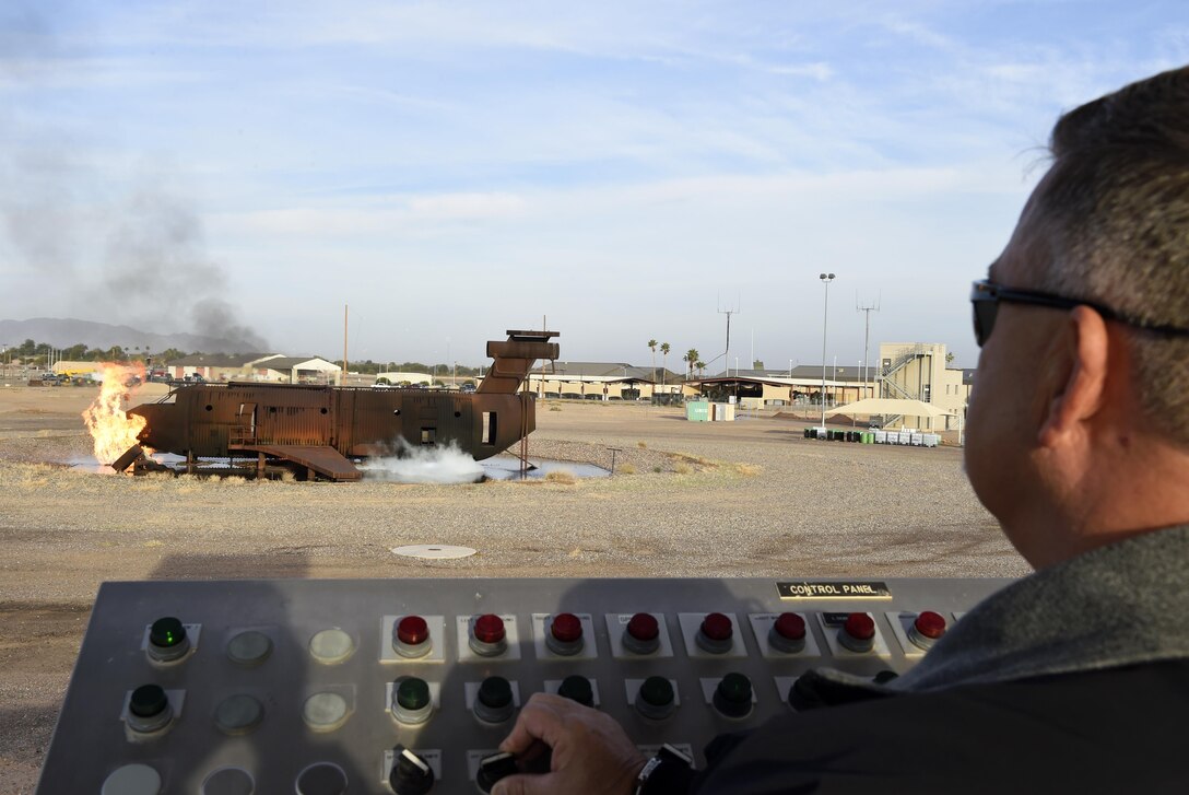 Steven Kinkade, 56th Civil Engineer Squadron assistant fire chief, prepares the training area by burning any excess fuel left from previous training exrcises Dec. 7, 2016, at Luke Air Force Base, Ariz. For each session on the training aircraft, firefighters use anywhere from 500 to 1000 gallons of fuel. (U.S. Air Force photo by Senior Airman James Hensley)