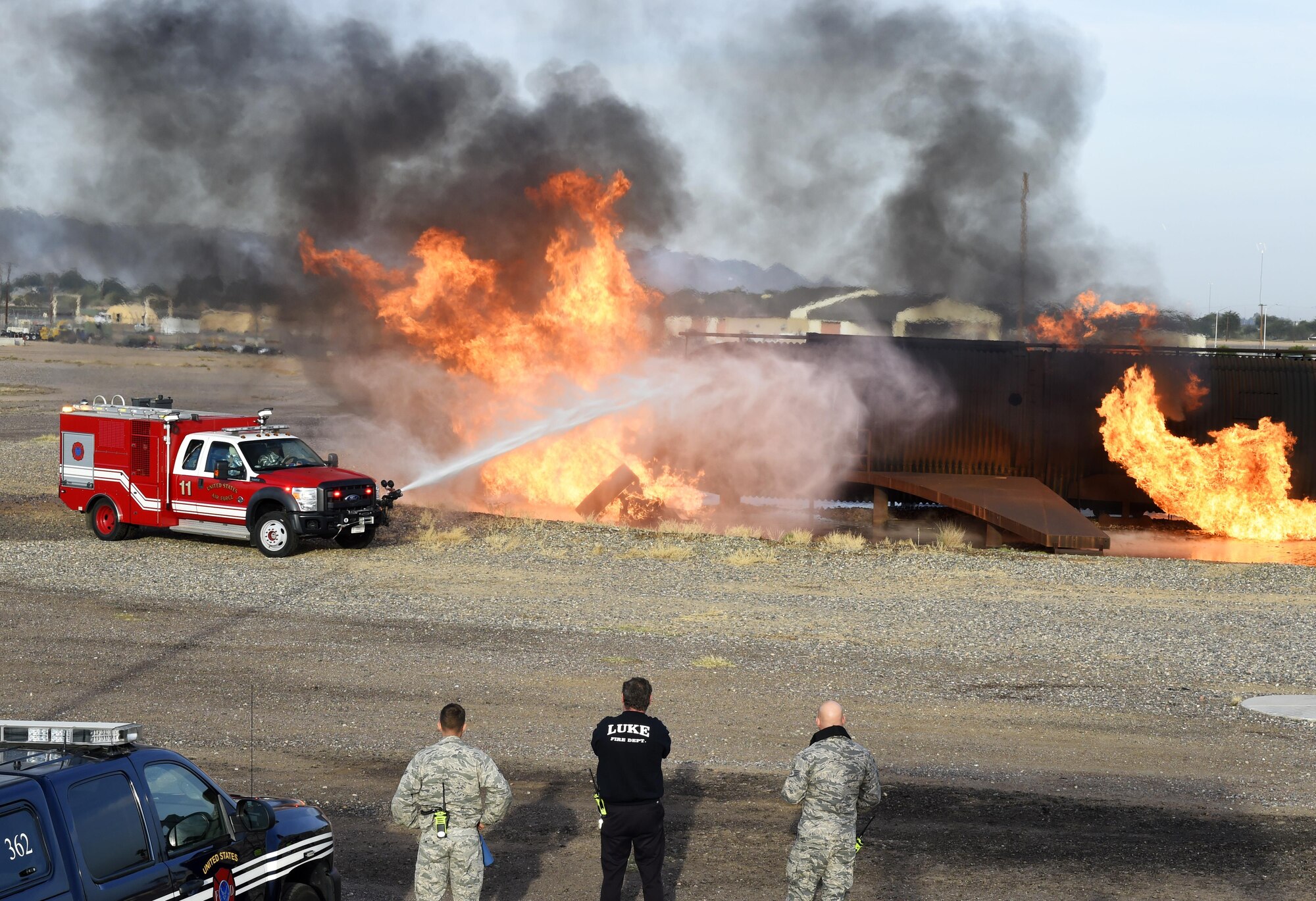 The 56th Civil Engineer Squadron firefighters, use a rapid intervention vehicle to respond to an aircraft fire during training Dec. 7, 2016, at Luke Air Force Base, Ariz. The firefighters were training on responding to an aircraft fire and using RIVs. (U.S. Air Force photo by Senior Airman James Hensley)