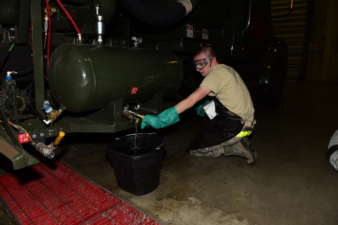 Airman 1st Class Levi Booker, a preventative maintenance apprentice assigned to the 28th Logistics Readiness Squadron, checks the pressure during a preventative maintenance inspection at Ellsworth Air Force Base, S.D., Dec. 14, 2016. Preventative maintenance keeps the 15 vehicles ready and serviceable at all times. (U.S. Air Force photo by Airman 1st Class James L. Miller)