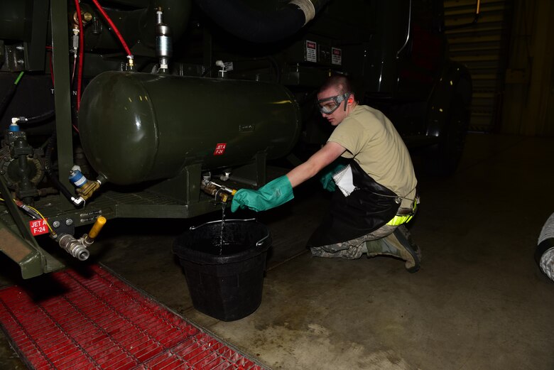 Airman 1st Class Levi Booker, a preventative maintenance apprentice assigned to the 28th Logistics Readiness Squadron, checks the pressure during a preventative maintenance inspection at Ellsworth Air Force Base, S.D., Dec. 14, 2016. Preventative maintenance keeps the 15 vehicles ready and serviceable at all times. (U.S. Air Force photo by Airman 1st Class James L. Miller)