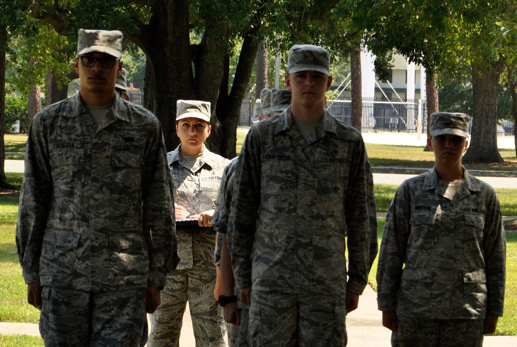 Tech. Sgt. Cassandra Cruz, 81st Force Support Squadron Airman Leadership School instructor, grades a flight during drill practice at the ALS building, July 21, 2016, on Keesler Air Force Base, Miss. Cruz was selected as one of this year’s 12 Outstanding Airmen of the Year. (U.S. Air Force photo by Tech. Sgt. Kimberly Moore)