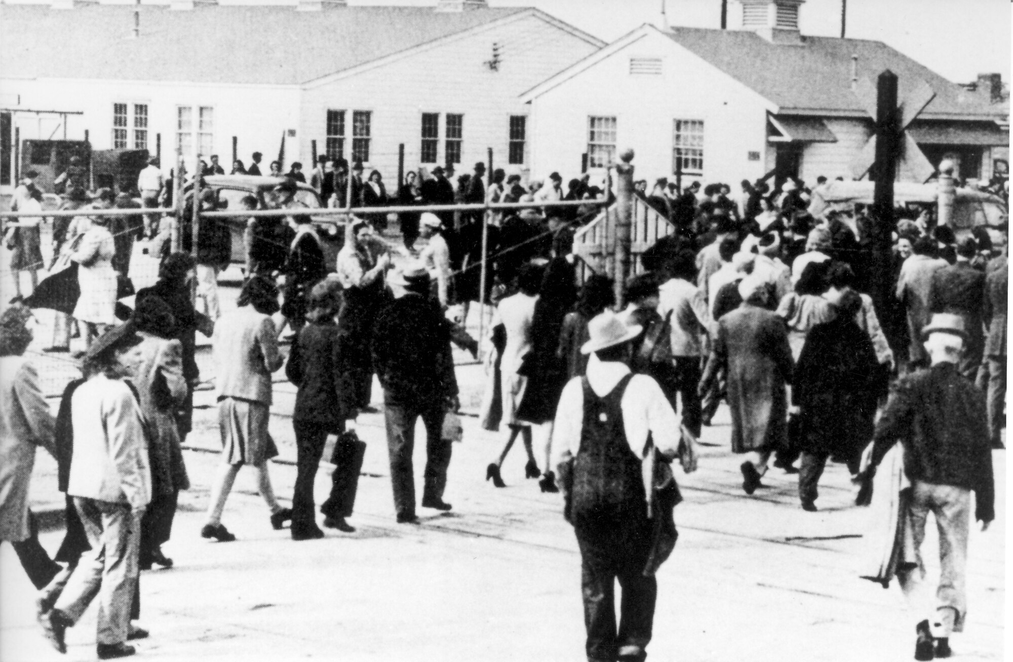 It's quitting time! Workers head home from their jobs at Tinker Air Force Base, circa 1940s.