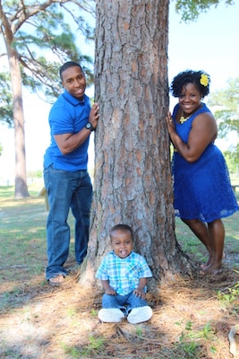 Petty Officer 1st Class Hilliard Kelly III, Joint Chiefs of Staff U.S. Navy and U.S. Marine Corps Personnel Service Manager, is currently stationed at the Pentagon with his wife, Tobia, and his son, Tristan. The Sailor has overcome a lot to get to where he is today. (Courtesy photo)
