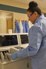 Raquel Hoskins, 5th Medical Support Squadron medical laboratory technician, places a blood sample in a chemistry analyzer at Minot Air Force Base, N.D., Dec. 13, 2016. Medical laboratory technicians conduct hematology, phlebotomy, urinalysis, chemistry and microbiology tests. (U.S. Air Force photo/Airman 1st Class Jessica Weissman)