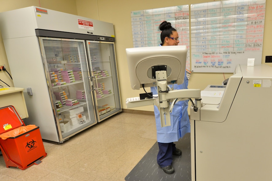 Raquel Hoskins, 5th Medical Support Squadron medical laboratory technician, uses a chemistry analyzer at Minot Air Force Base, N.D., Dec. 13, 2016. The analyzer tests glucose and electrolyte levels, and monitors kidney and liver function. (U.S. Air Force photo/Airman 1st Class Jessica Weissman)