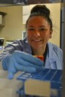 Raquel Hoskins, 5th Medical Support Squadron medical laboratory technician, retrieves a blood sample at Minot Air Force Base, N.D., Dec. 13, 2016. Medical laboratory technicians draw blood samples to aid medical providers with diagnosing and following up with previous diagnoses. (U.S. Air Force photo/Airman 1st Class Jessica Weissman)