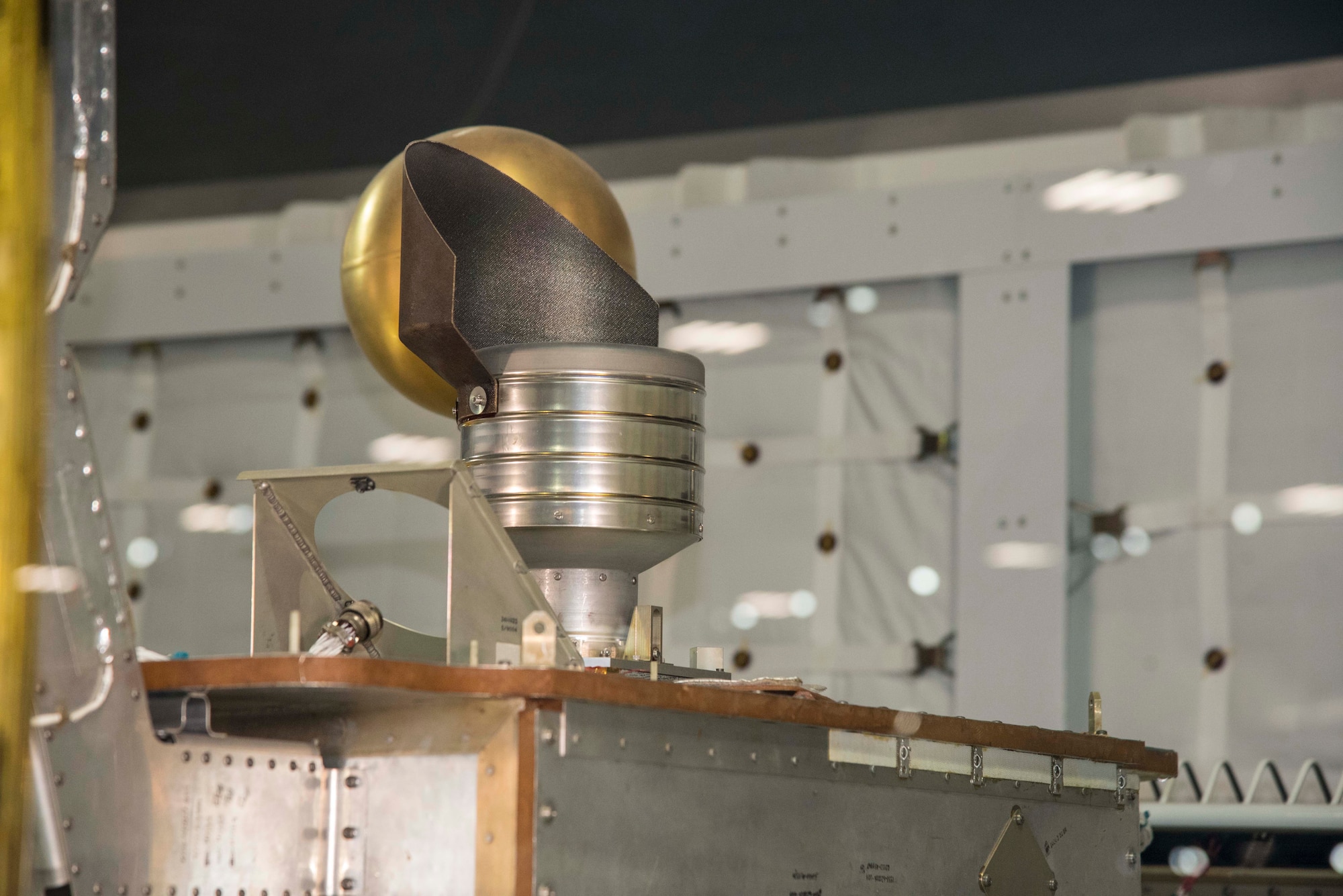 NASA Lewis (now Glenn) Researcher Center in Cleveland, OH, developed this ion thruster to help USAF spacecraft like P80-1 stay precisely positioned in space. The powerful lightweight thruster is electrical instead of a chemical rocket, and is powered by mercury. (U.S. Air Force photo by Ken LaRock)